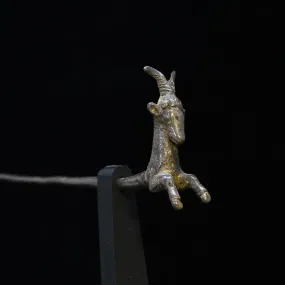 A Near Eastern silver Goat Pin, ca. 200 BCE - 200 CE